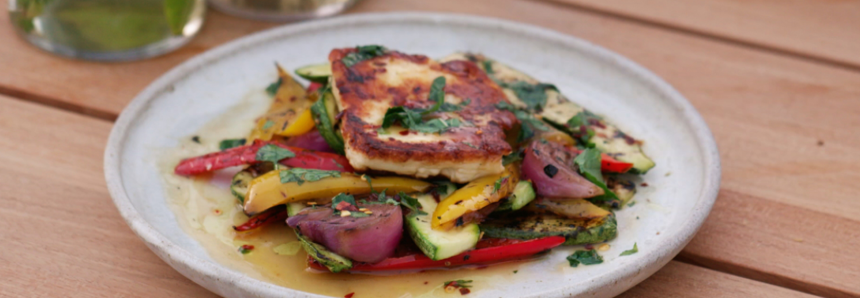 Grilled halloumi on a bed of char grilled vegetables